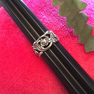 Silver rose band ring.